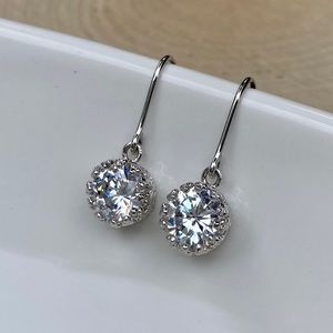 Sterling silver earrings with cz stones in a crown setting. Shepherds hooks